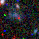 Colour composite: F444W red, F356W green, F277W blue, 3.2 arcsec across, north up
