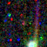 Colour composite: F444W red, F356W green, F277W blue, 3.2 arcsec across, north up