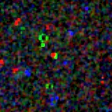 Colour composite: F444W red, F356W green, F277W blue, 3.2 arcsec across, north up