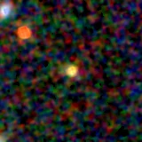 Colour composite: F444W red, F356W green, F277W blue, 3.2 arcsec across, north up