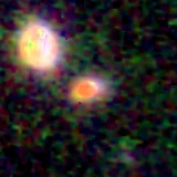 Colour composite: F444W red, F356W green, F277W blue, 3.2 arcsec across, north up