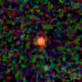 Colour composite: F444W red, F356W green, F277W blue, 3.2 arcsec across, north up