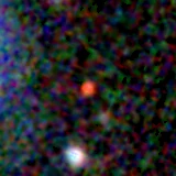 Colour composite: F444W red, F356W green, F277W blue, 3.2 arcsec across, north up