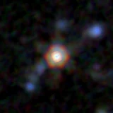 Colour composite: F444W red, F356W green, F277W blue, 3.2 arcsec across, north up